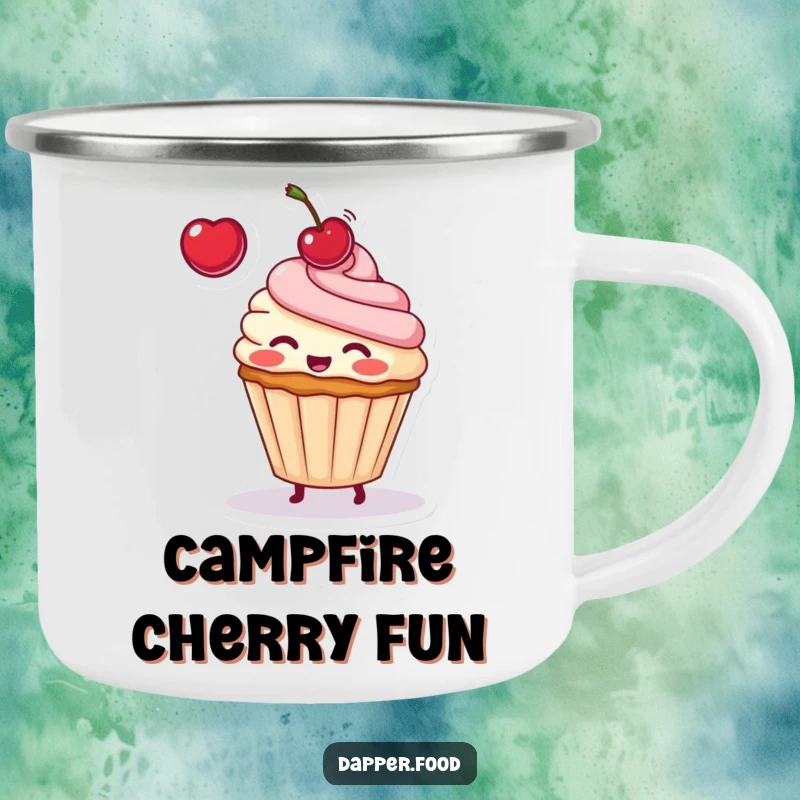 Funny enamel camping mug with a blushing cupcake character playfully tossing a cherry, suitable for any outdoor setting.