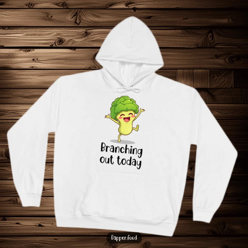 Funny anthropomorphic broccoli floret character mid-cartwheel, bringing vibrant, humorous energy to a warm and cozy hoodie.